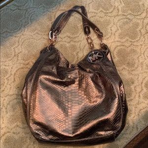 Brown Michael Kors handbag with snake skin texture